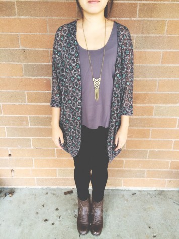 Junior Shannon Tran is wearing a bright tanktop, with a floral kimono, a necklace, black pants and combat boots. This outfit is simple and has a great spring feel to it.  