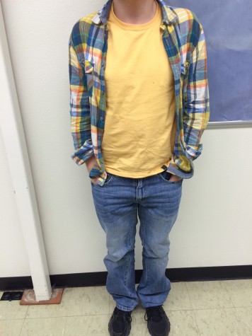 Junior Brock Nichols wears a bright flannel with a yellow shirt and light jeans. All of these pieces come together to form a perfect spring look.  