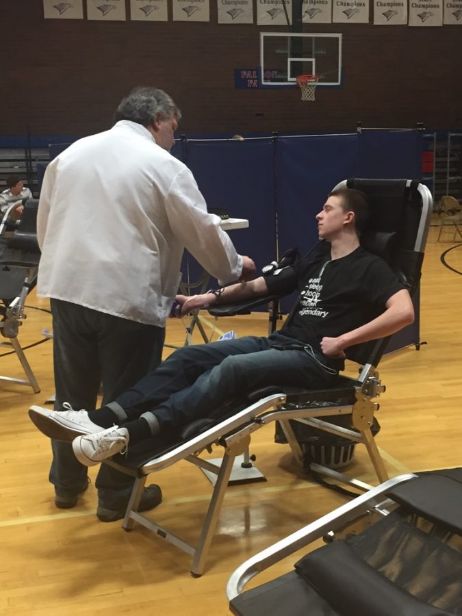 Senior Patrick Dowhaniuk donates blood during last years blood drive.