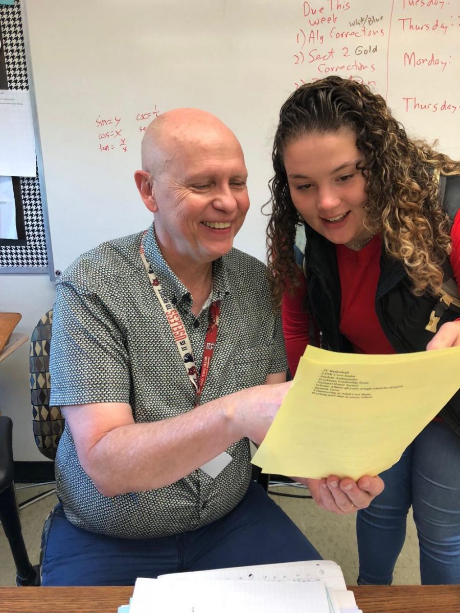 Mr. Swansons favorite part of his job is working with students, pictured here with senior Megan Lyver.