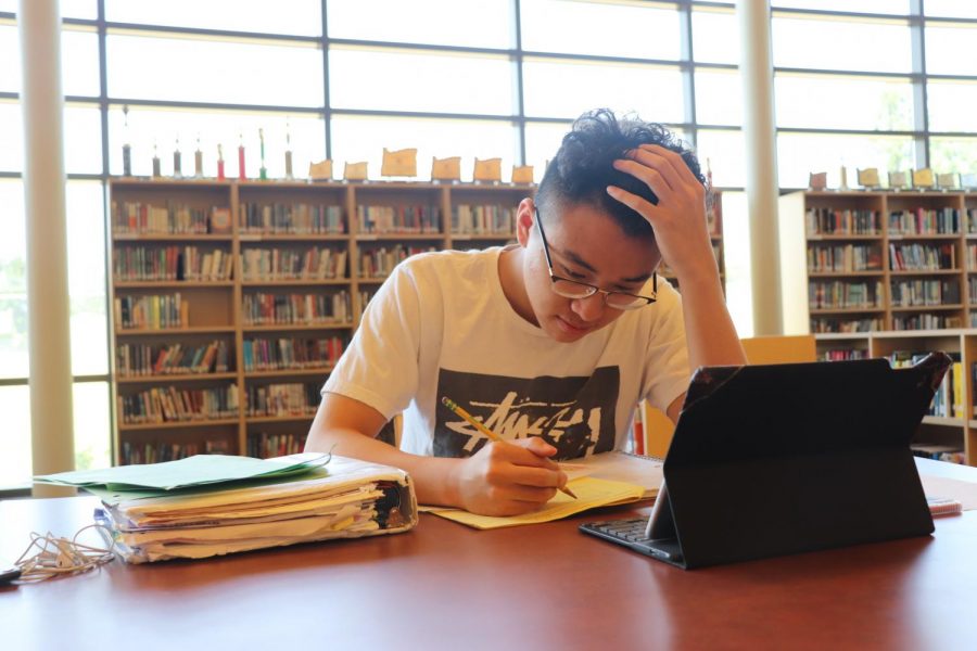 Senior Ben Luu hard at work studying in the library. Although schoolwork is important, so is taking a break and finding time for yourself.  