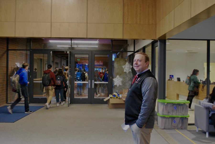 Mr. Kuffner greeting students before school.
