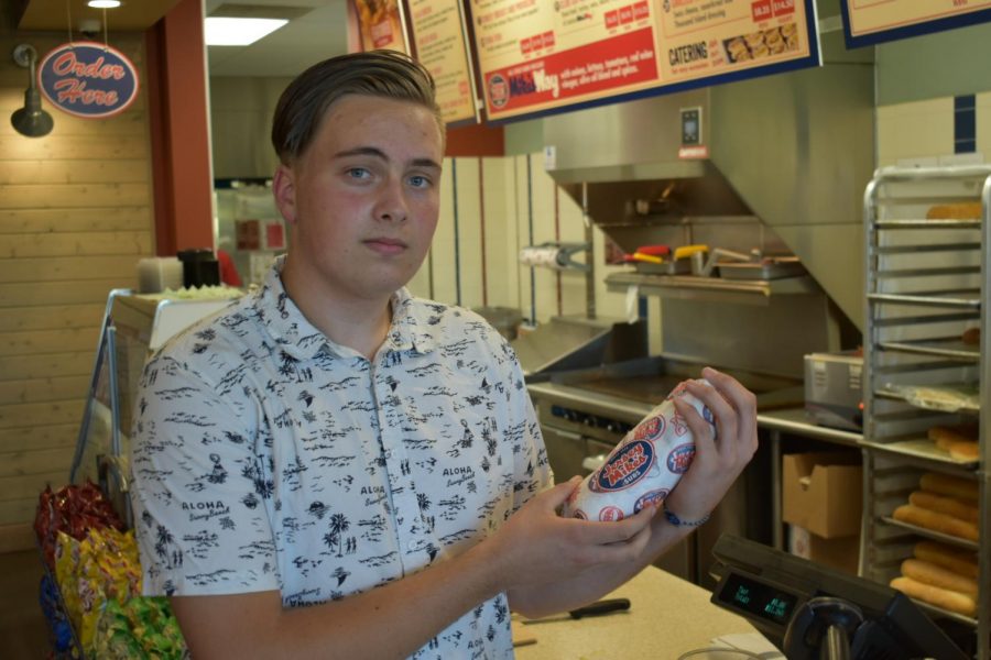 Senior Ian Pearson holding one of the subs he made at Jersey Mikes Subs.