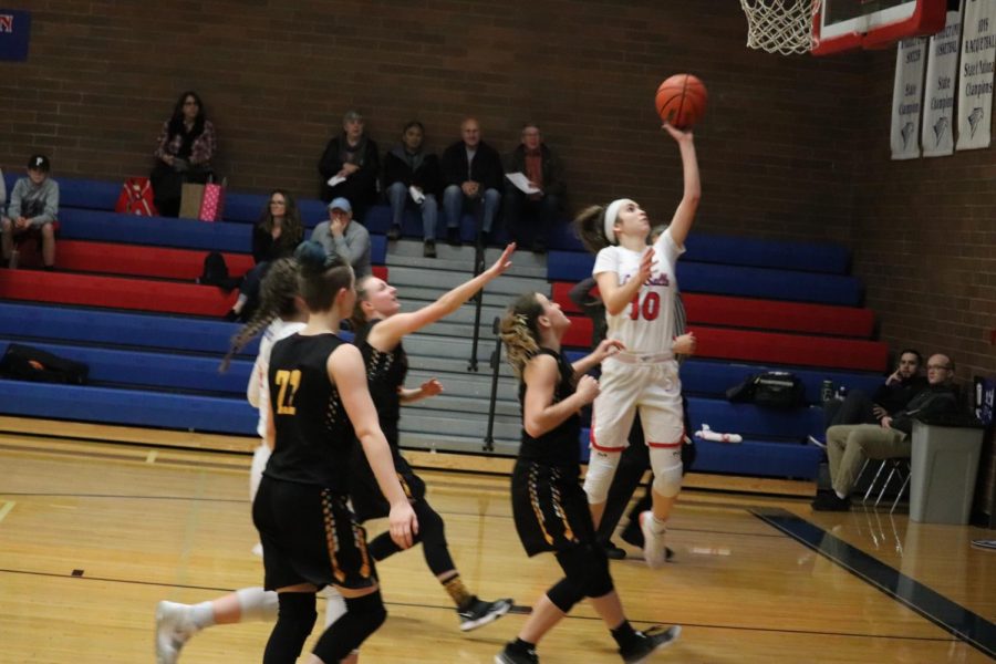 Sophomore Mandy Sisul goes in for layup.