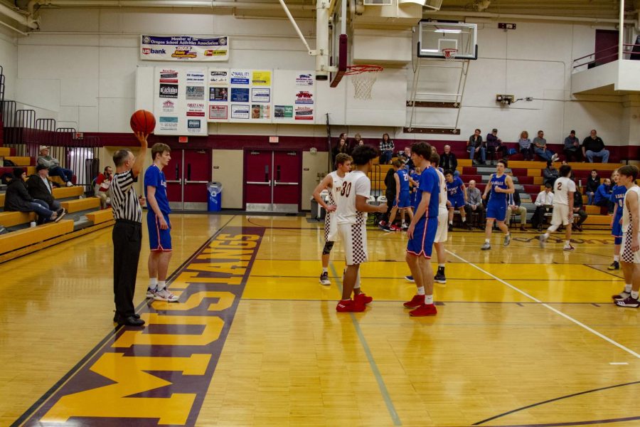 Senior Jace Norton prepares to bring the ball back into the game against #18 Milwaukie.