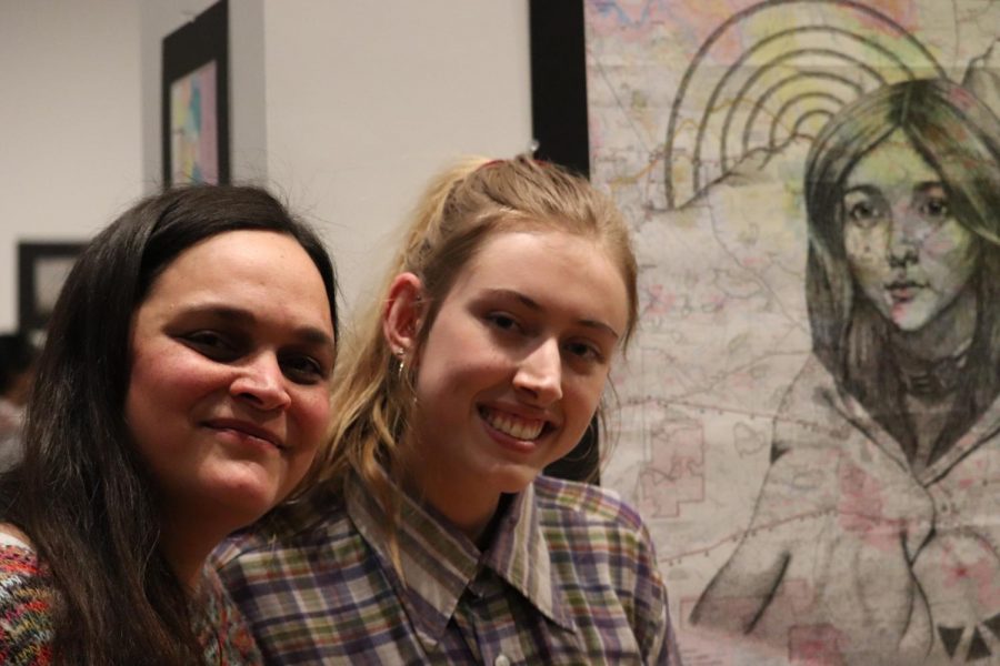 Mrs. Cha and senior Emma Sheets pictured next to Sheets piece that was given a Gold Key and nominated for an American Visions Medal.