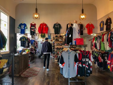 Junior Robby Collman browses the shoe and clothing selection at GOAT, a new sports and street style shop in Sellwood.