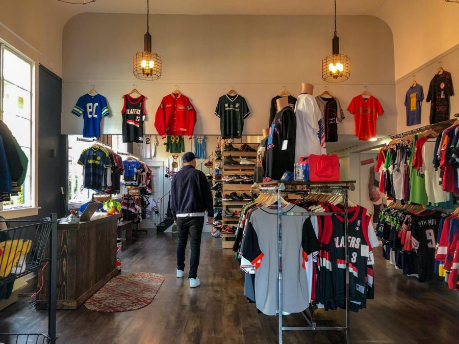Junior+Robby+Collman+browses+the+shoe+and+clothing+selection+at+GOAT%2C+a+new+sports+and+street+style+shop+in+Sellwood.