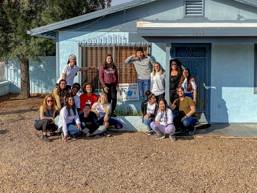 The immersion attendees gather outside of their home for the week.