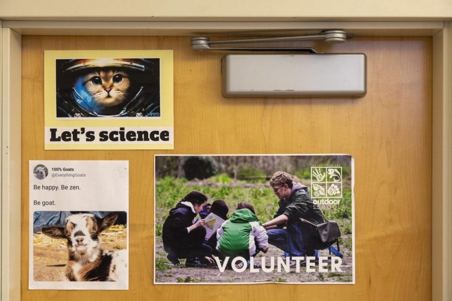 A poster in a science classroom quietly advertises the Outdoor School program.