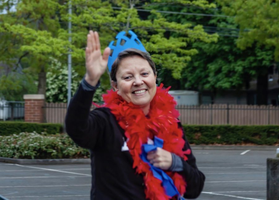 Ms. Powell waves to students at a recent "Be the Light" night.