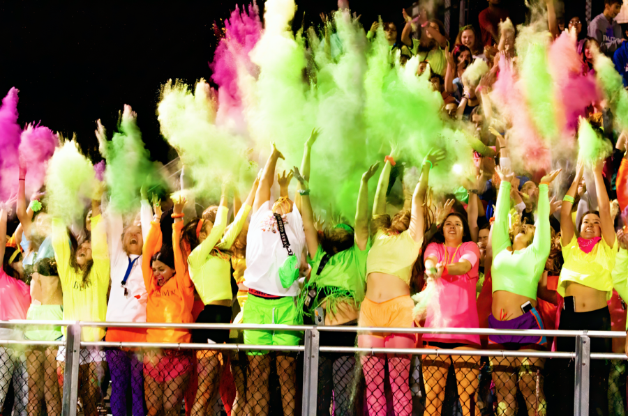 Students of La Salle Prep throw colored powder into the air at the end of halftime at the first home football game of the season. La Salle lost the game against St. Bernard’s Academy, a school from California, with a final score of 41-43.