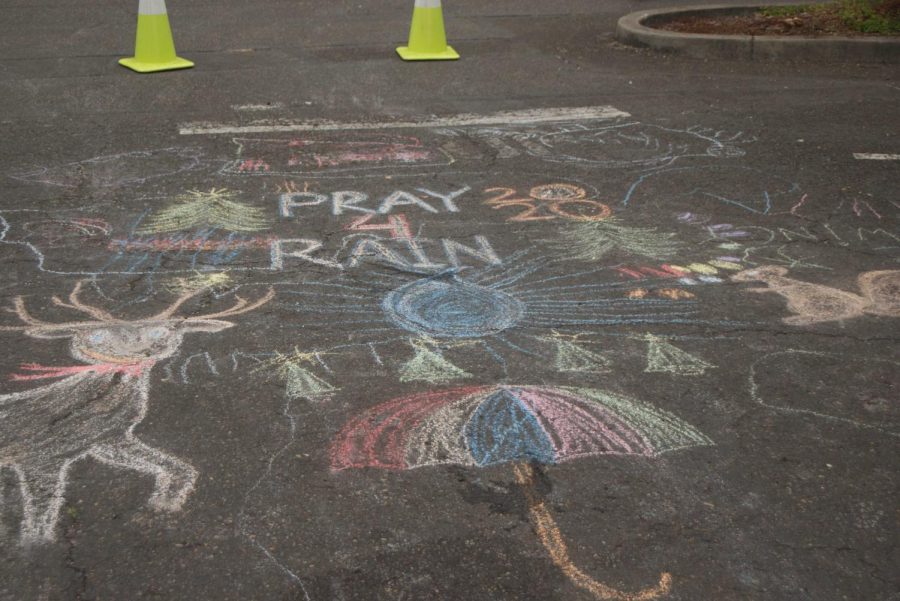 “Pray 4 Rain 2020” outside one trailer has become one of the centerpieces on the main pathways. 