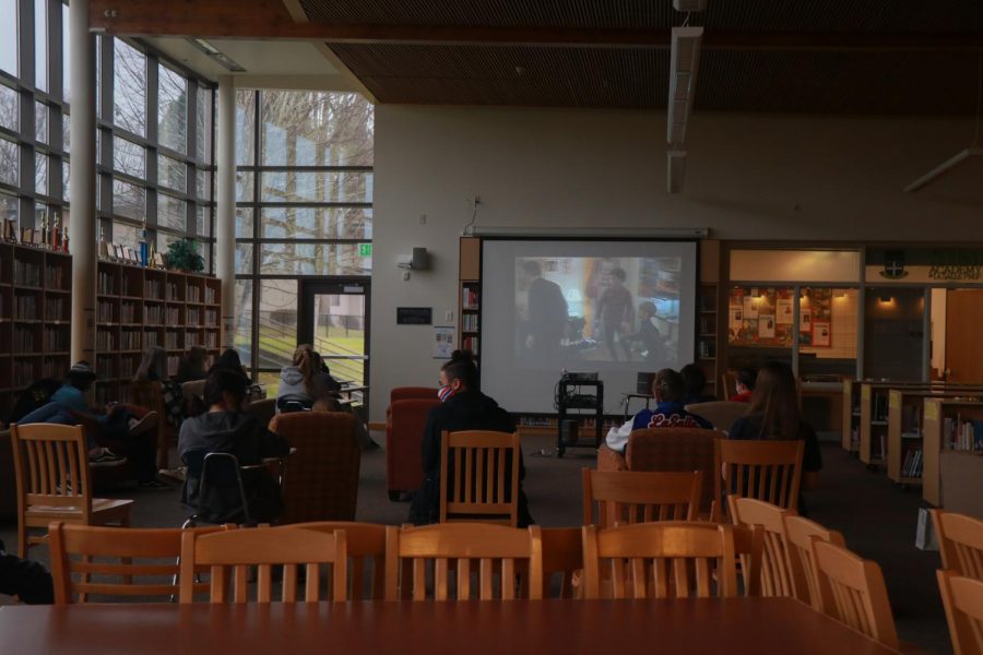 Students gathered in the library to watch Home Alone. 
