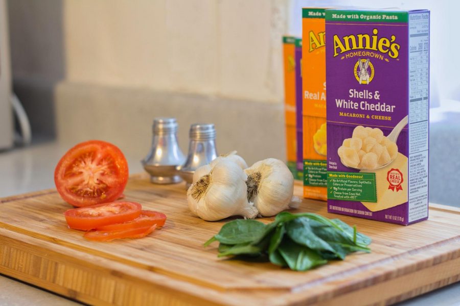 To help mix up regular boxed mac and cheese, try looking around your kitchen for ingredients that can easily be thrown in for some extra flavor. 