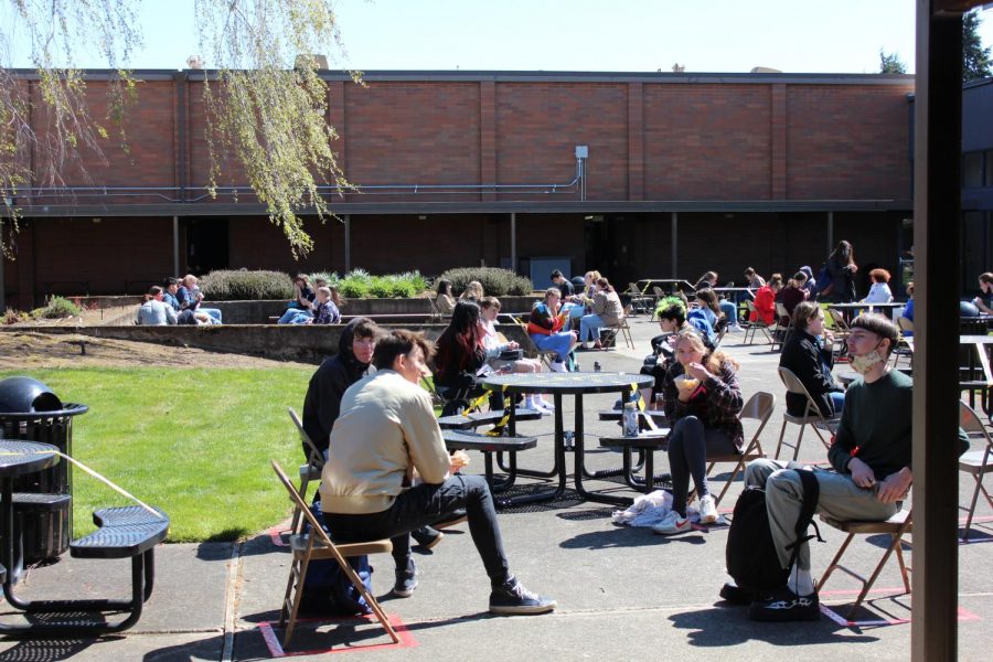 During lunches, students were required to sit at designated seats at tables, in a desk in a courtyard, or in a metal folding chair surrounded by red tape on the ground. 