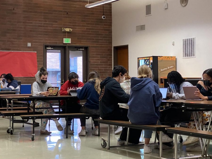 Some students worked on their classwork in the cafeteria during their U.S. History class with Mr. Hugh Hegarty.