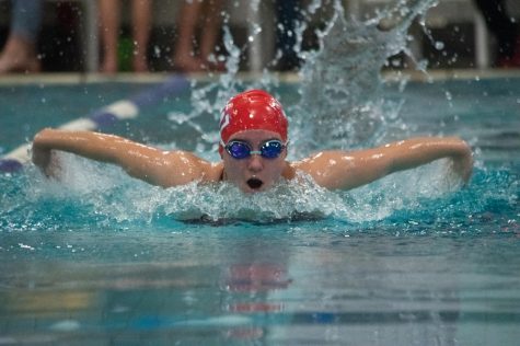 Junior Lilly Tiller swam the butterfly in the 100-yard butterfly event.