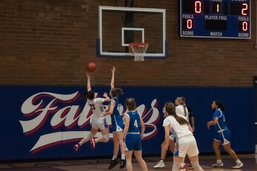 Senior Mia Skoro sprung into the air to score the first points for La Salle.