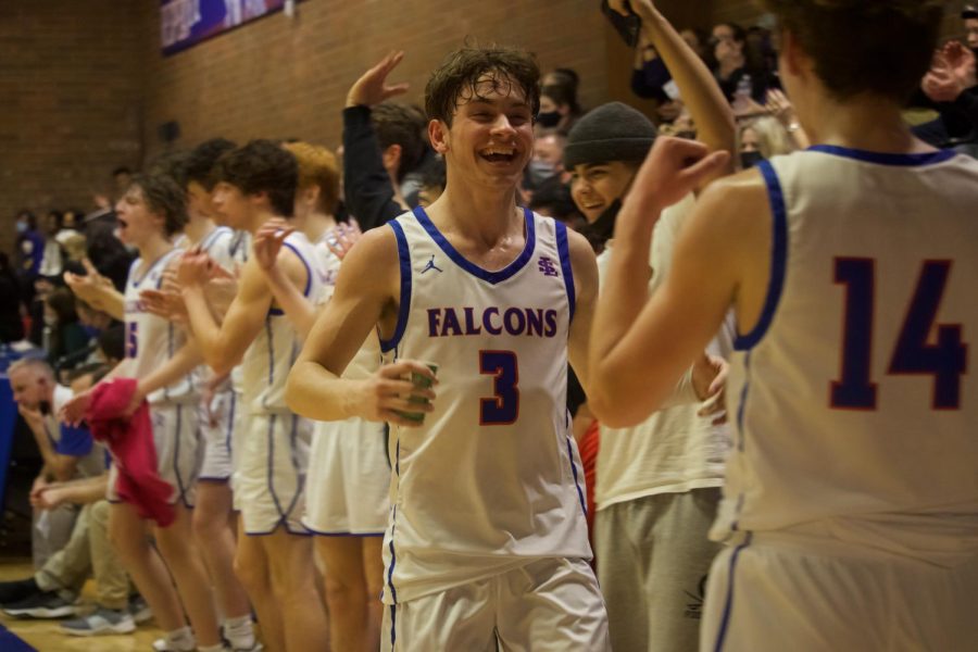Senior Jacob Scacco celebrated after a basket was scored against Parkrose. 