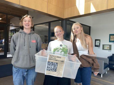 Students Roscoe Mithoefer, Kamryn Houghton, and Vicki Poletiek are in charge of planning the school supplies drive, along with help from Director of Service Ms. Maher. 