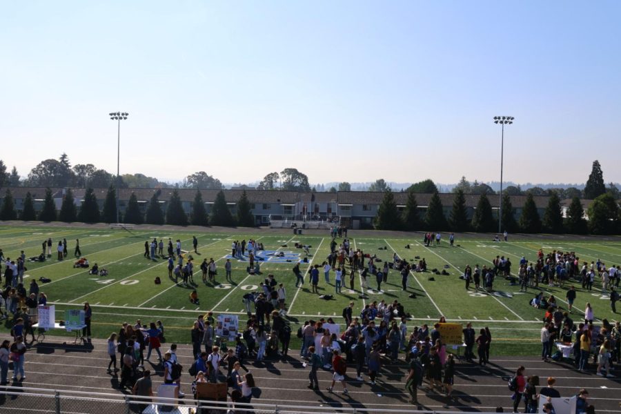 Students gathered on the athletic field for the club fair.