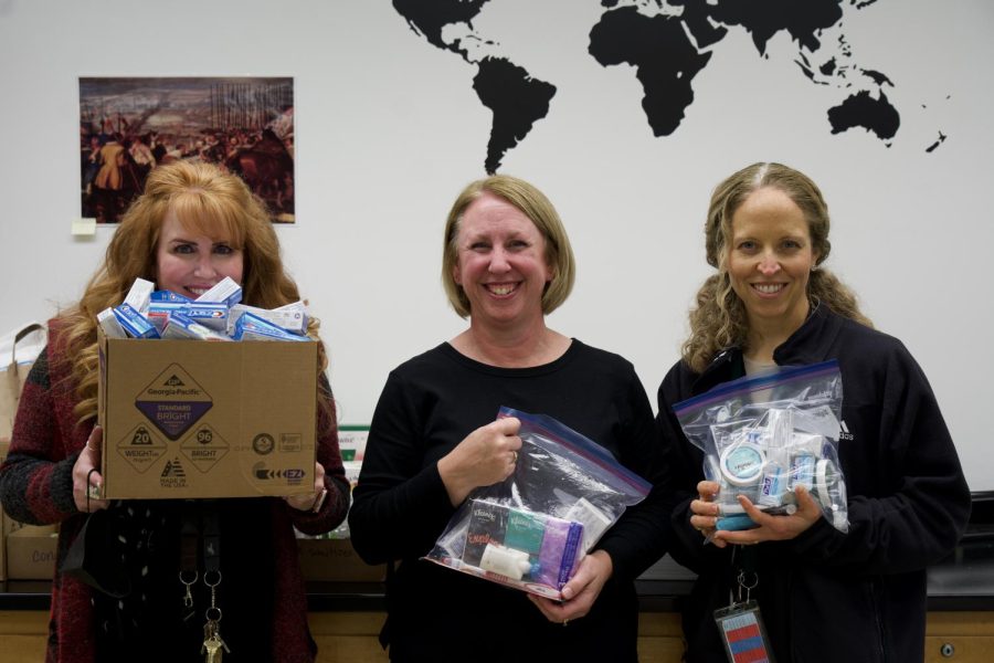 Spanish 2 teachers collect and organize hygiene kits for those in need. 

