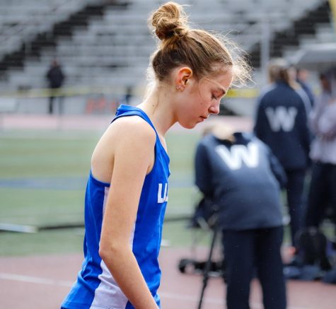 Freshman Emma Smith is focused and ready before her 400m race at the Wilsonville and Milwaukie track meet.