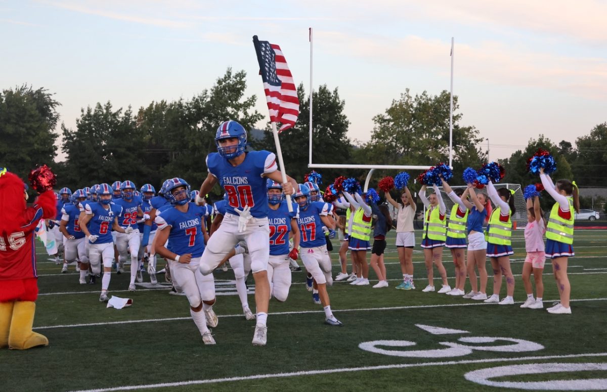 The La Salle varsity football team and cheer team shined on Future Falcon Night as they hosted Milwaukie High School, showcasing the exhilaration of victory and the unwavering bonds of camaraderie and community beneath the radiant Friday night lights.