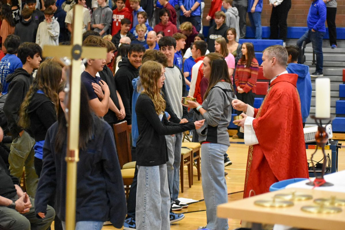 Students and staff gathered in the gym for the homecoming Mass.