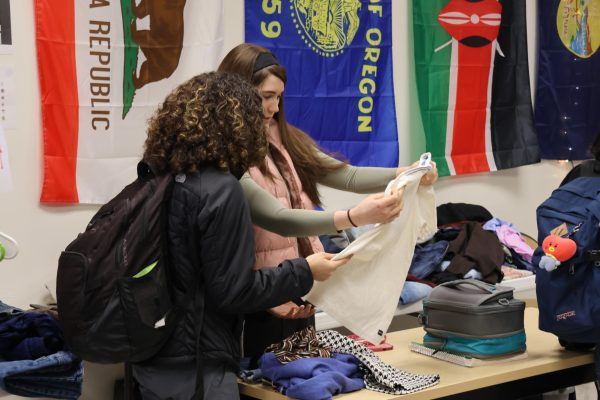Sophomore Gabrielle Jones, shown here on the right, said she chose to visit the thrift store because her friends recommended it and the “good” selection of clothes available.