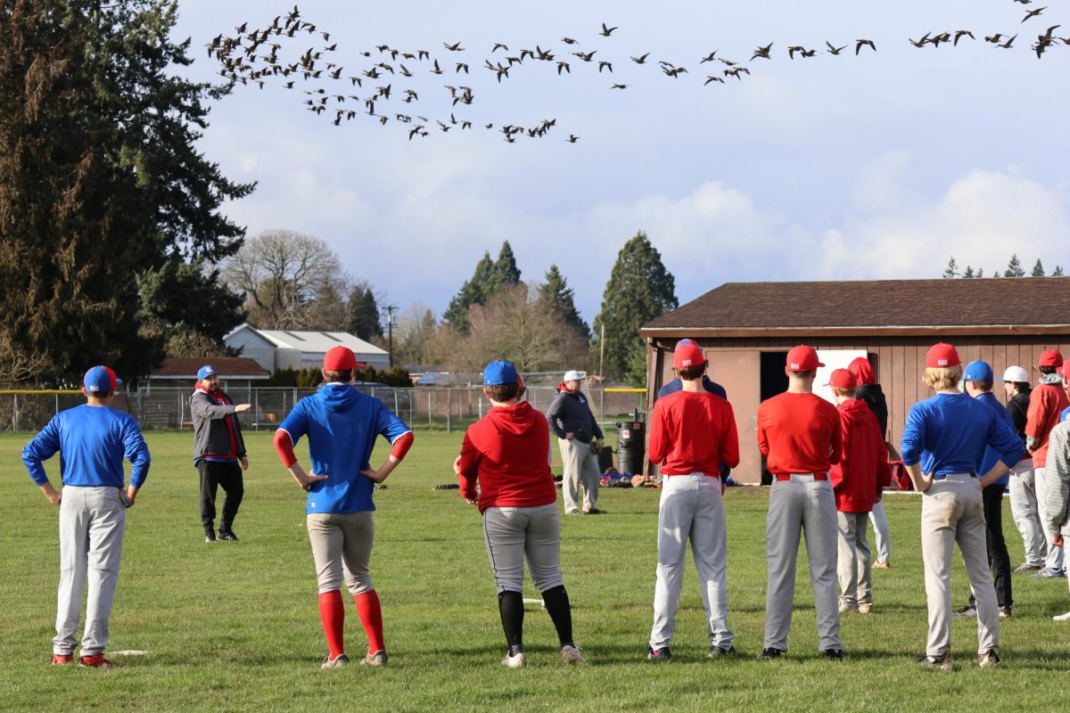 The boys baseball team enjoys practice without rainy weather.