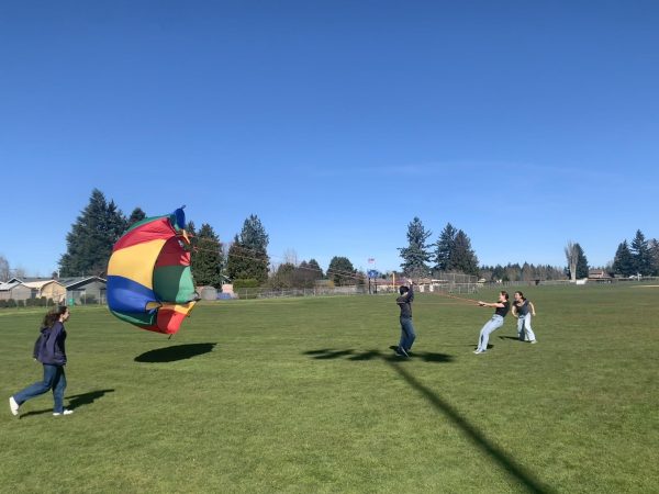 Students play with a parachute during Flex on Friday.