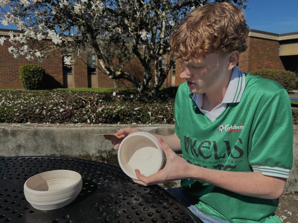 Senior Luke Foley sands a bowl during his Advanced 3D Art class. 