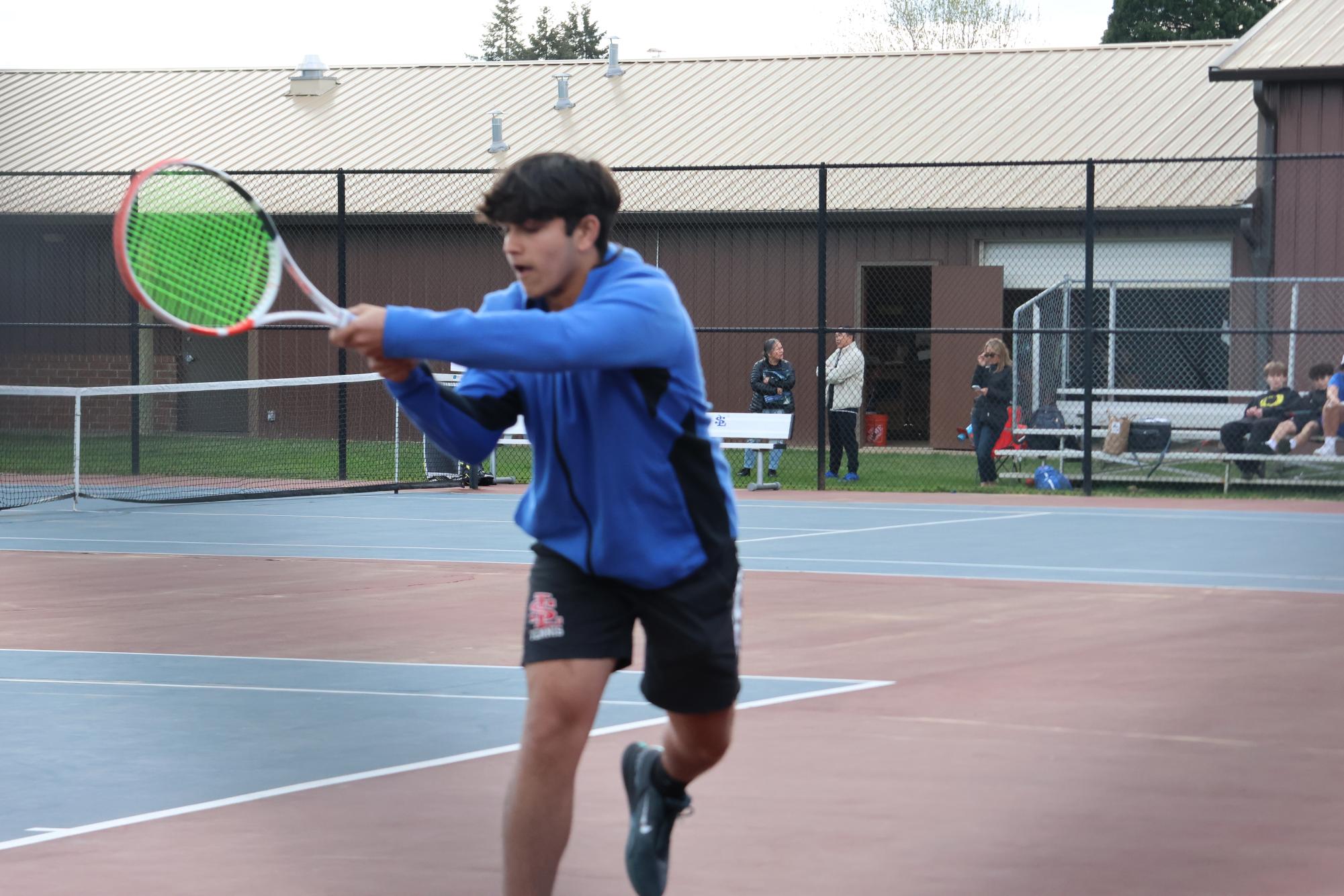 Photo+Story%3A+Boys+Tennis+Team+Competes+Under+the+Cloudy+Sky