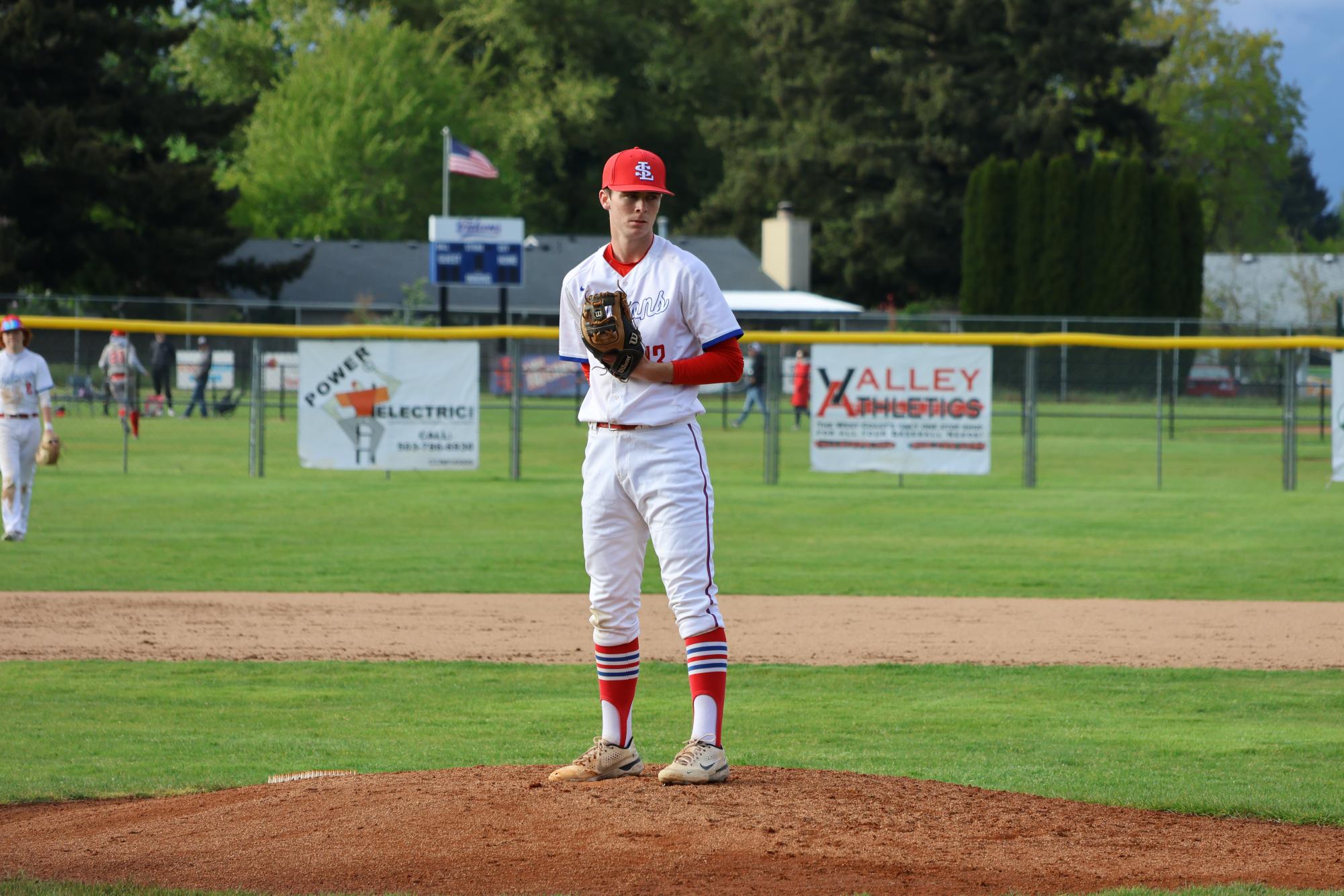 Photo Story: Varsity Baseball Overcomes Centennial 11–10