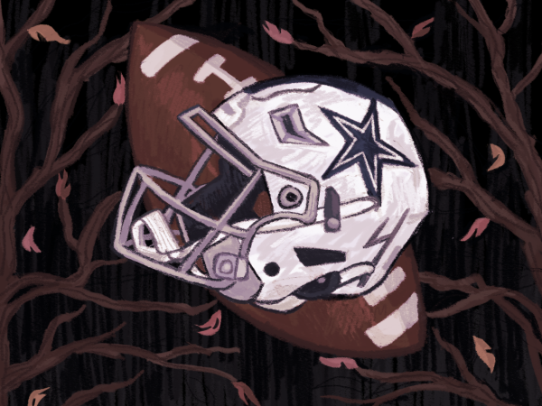 A Dallas Cowboys helmet rests on a football and dead leaves, symbolizing the team’s lifeless and disappointing 2024 season.