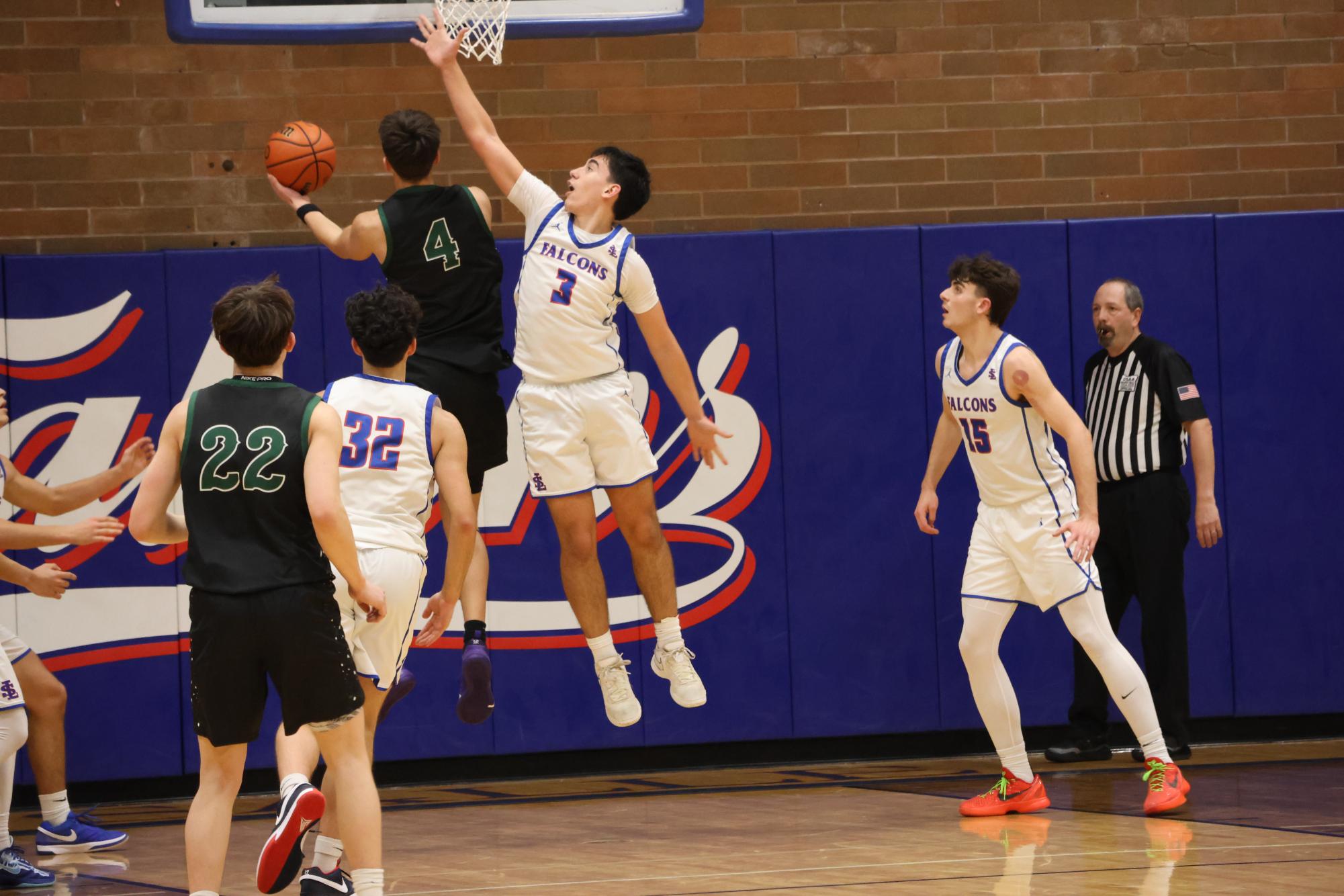 Photo Story: Boys Basketball Defends The Nest Against Summit