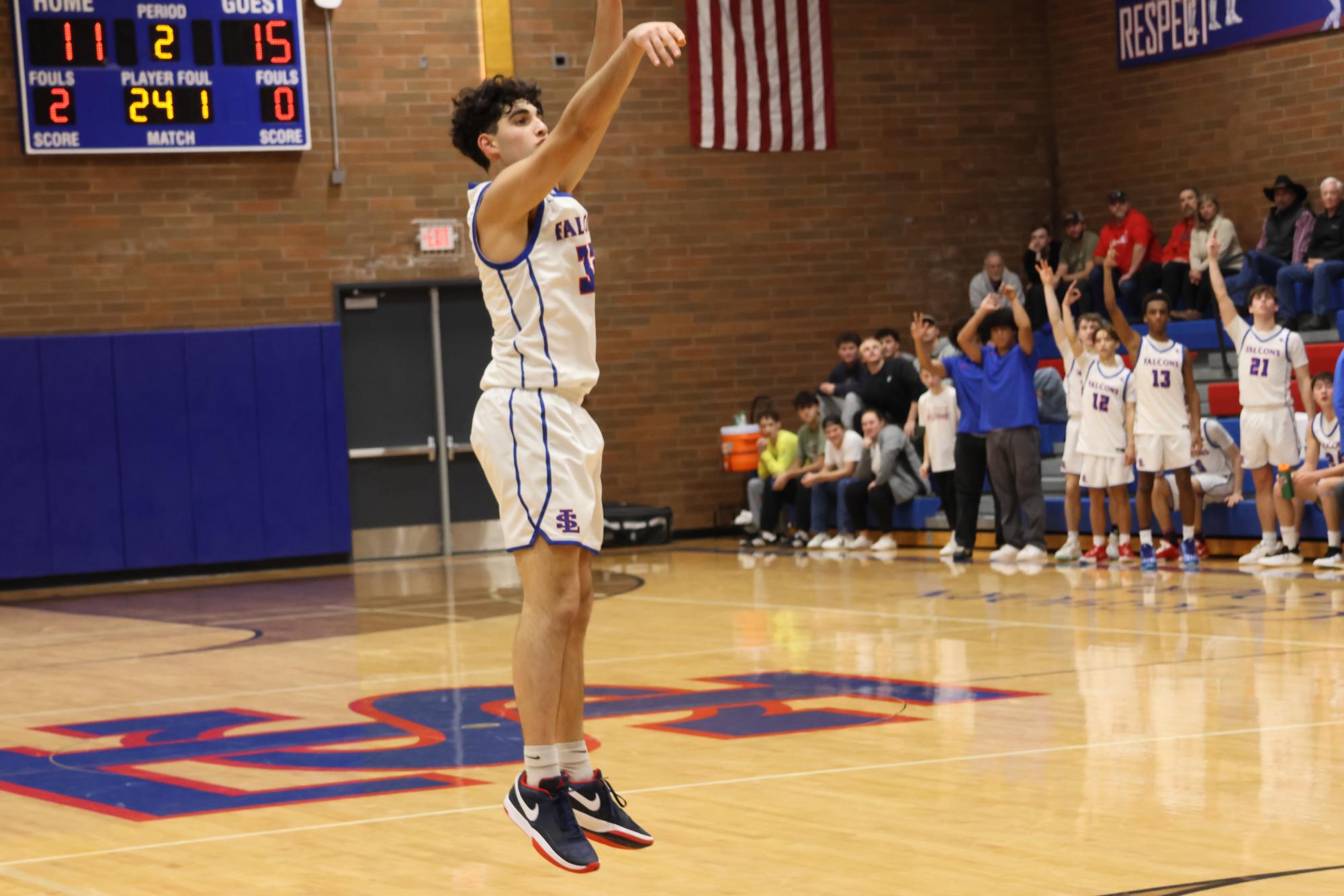 Photo Story: Boys Basketball Defends The Nest Against Summit