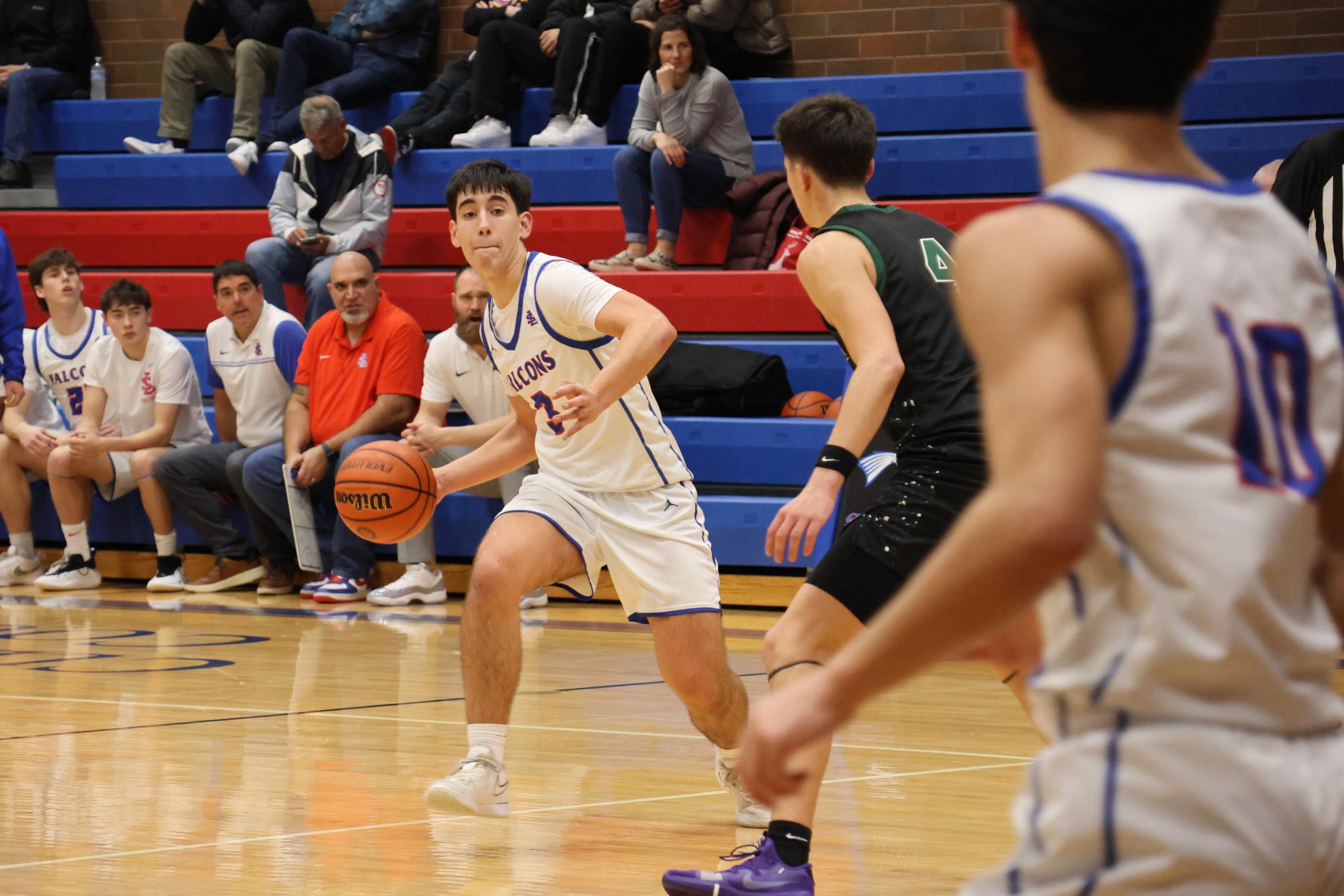 Photo Story: Boys Basketball Defends The Nest Against Summit