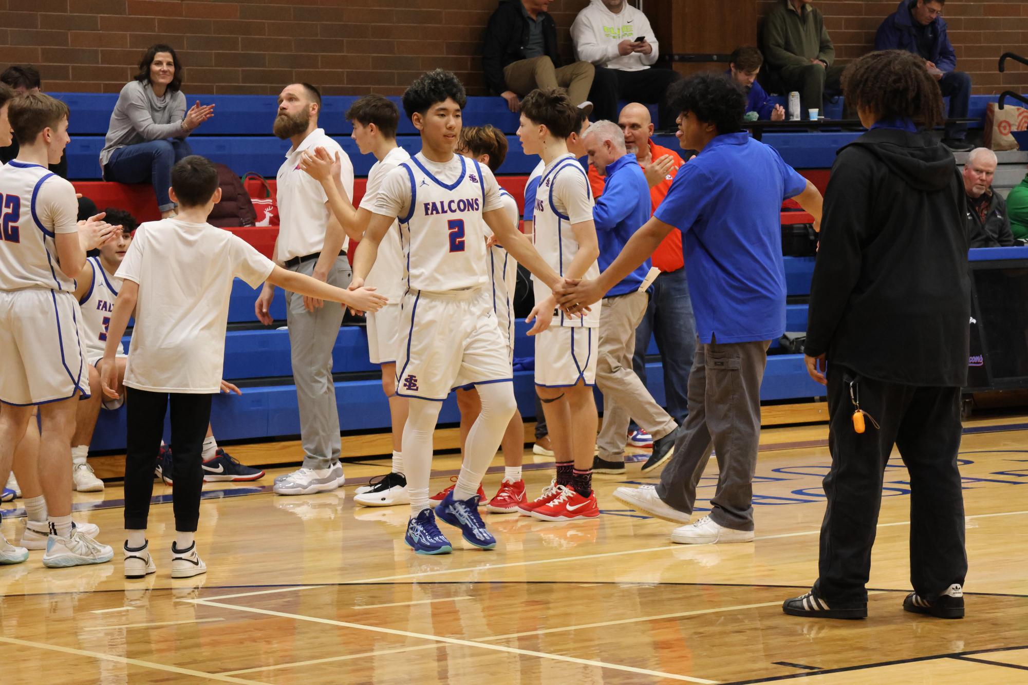 Photo Story: Boys Basketball Defends The Nest Against Summit