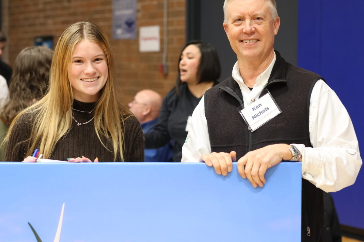 Junior Madeline Schnyder stood with Ken Nichols, who spoke during the career fair about his business, Avangrid Renewables, which develops renewable energy sources in the Pacific Northwest.