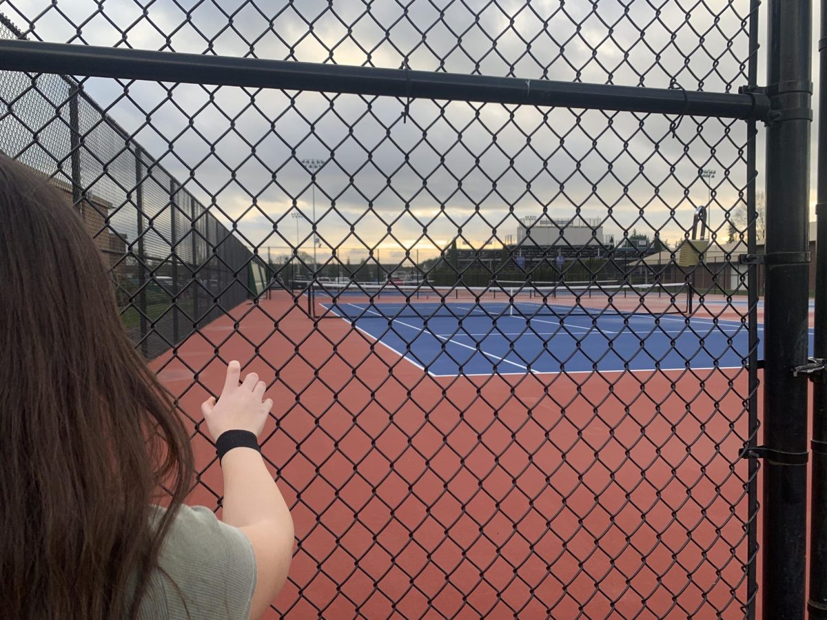 Senior Kennedy Harris enjoys the community aspect she has found in high school tennis, and tries to take that spirit with her when she competes by herself.