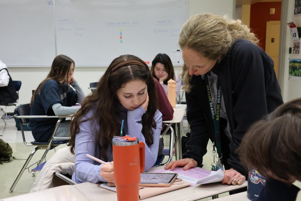 Spanish teacher Ms. Amy Gantt helps a junior Gabrielle Jones with classwork.