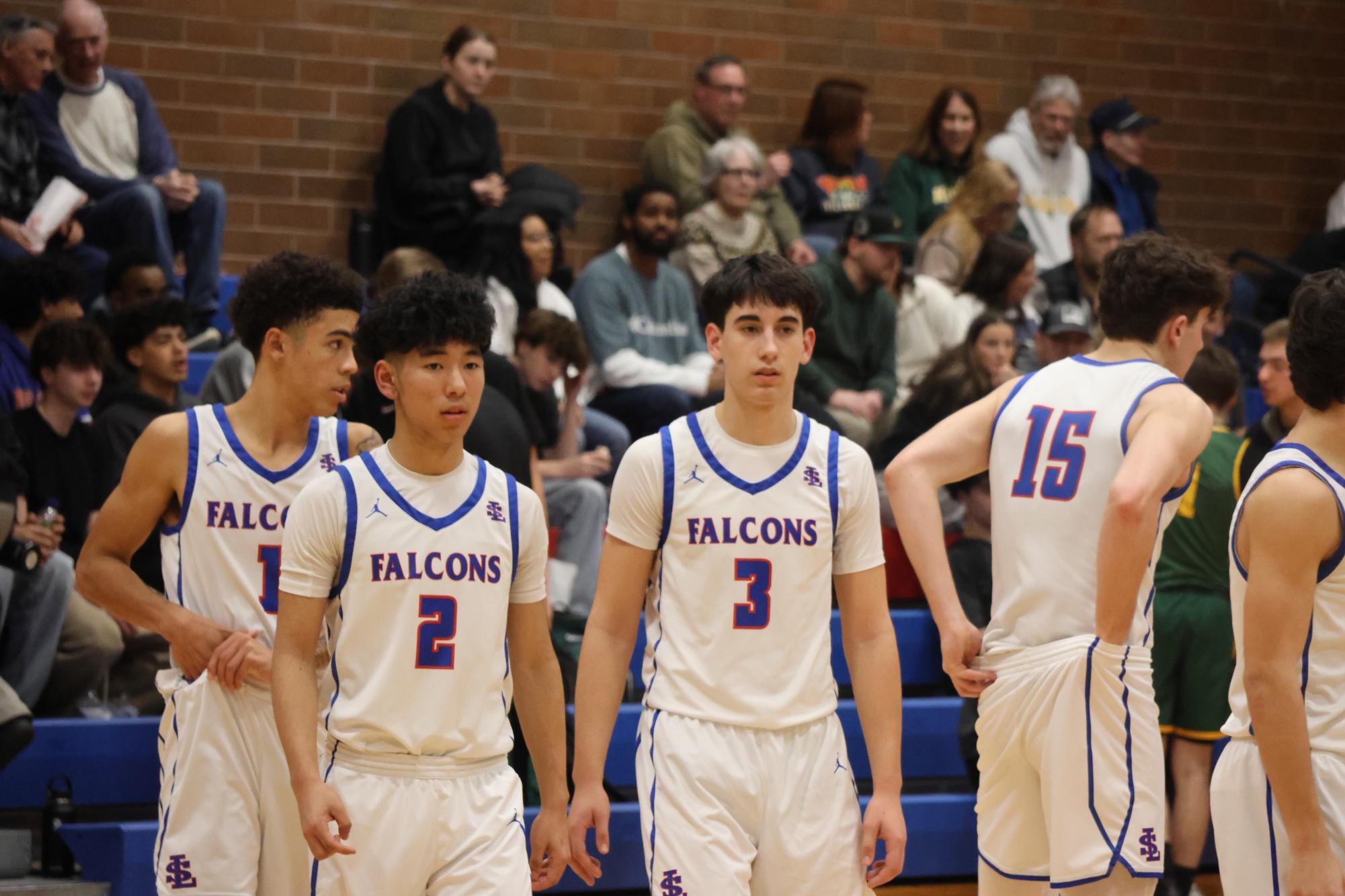 Photo Story: Boys Basketball Defends the Nest Against Rex Putnam