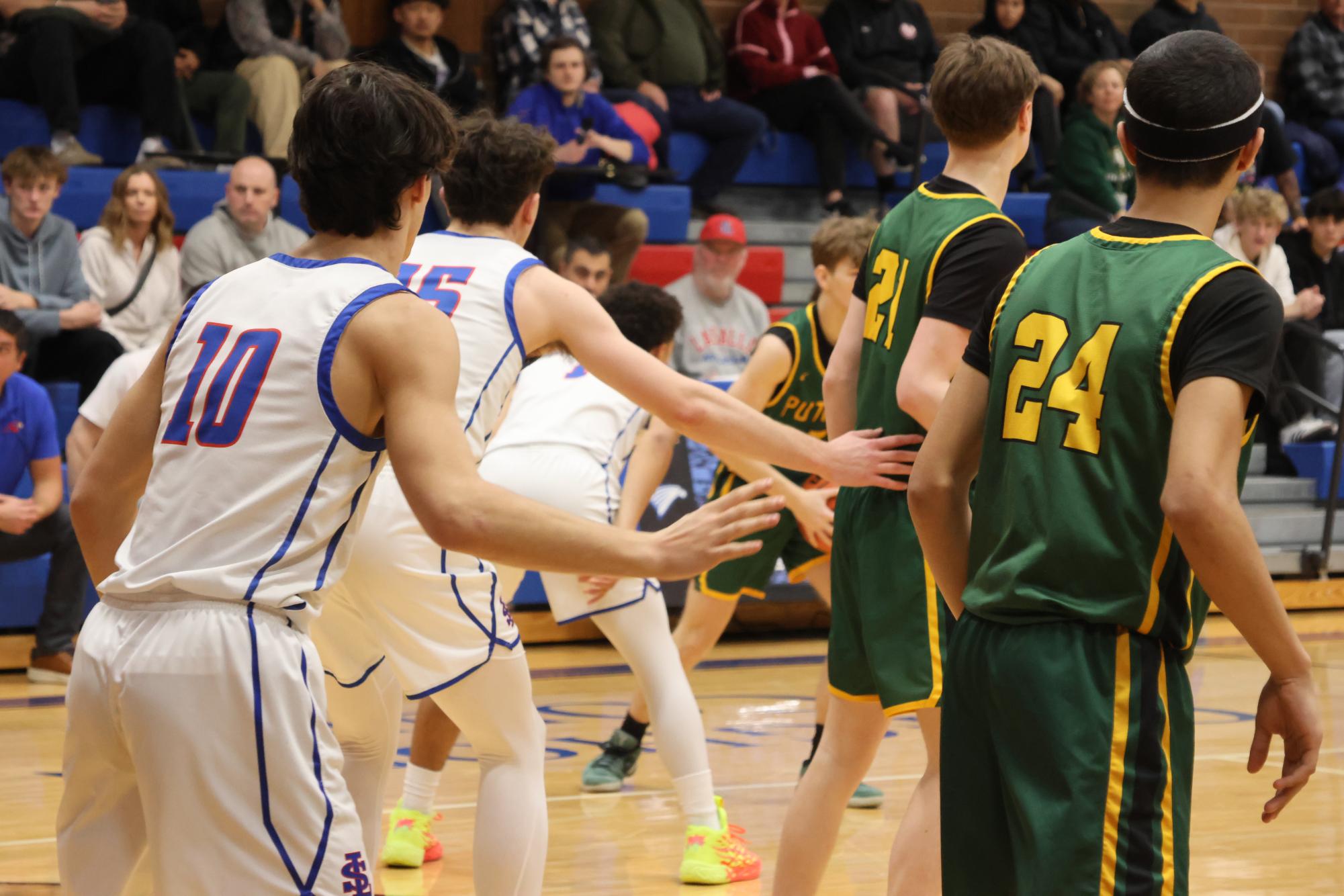 Photo Story: Boys Basketball Defends the Nest Against Rex Putnam