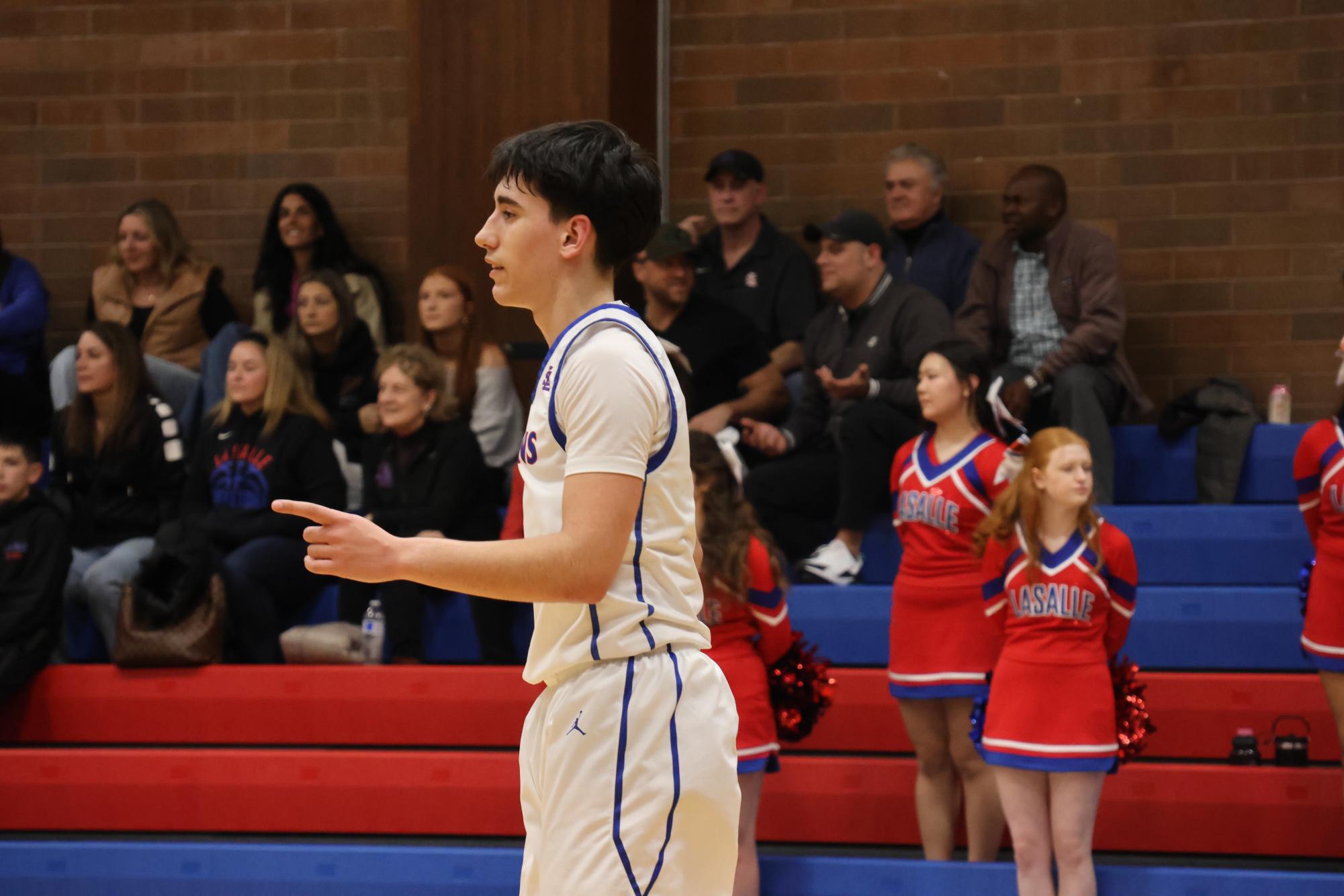 Photo Story: Boys Basketball Defends the Nest Against Rex Putnam