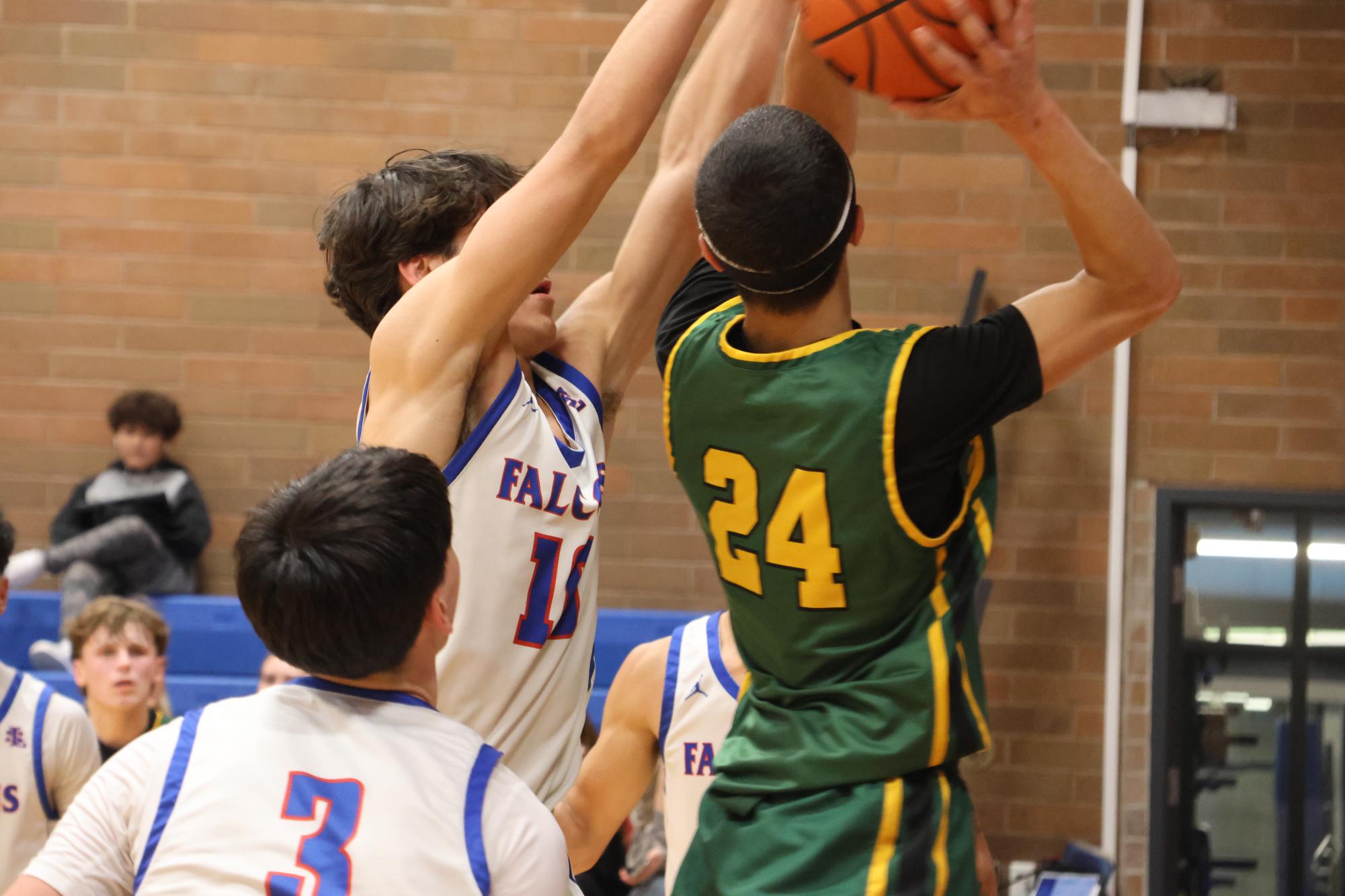 Photo Story: Boys Basketball Defends the Nest Against Rex Putnam