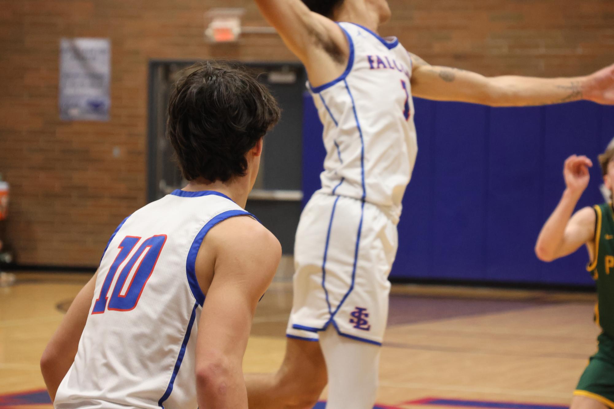 Photo Story: Boys Basketball Defends the Nest Against Rex Putnam