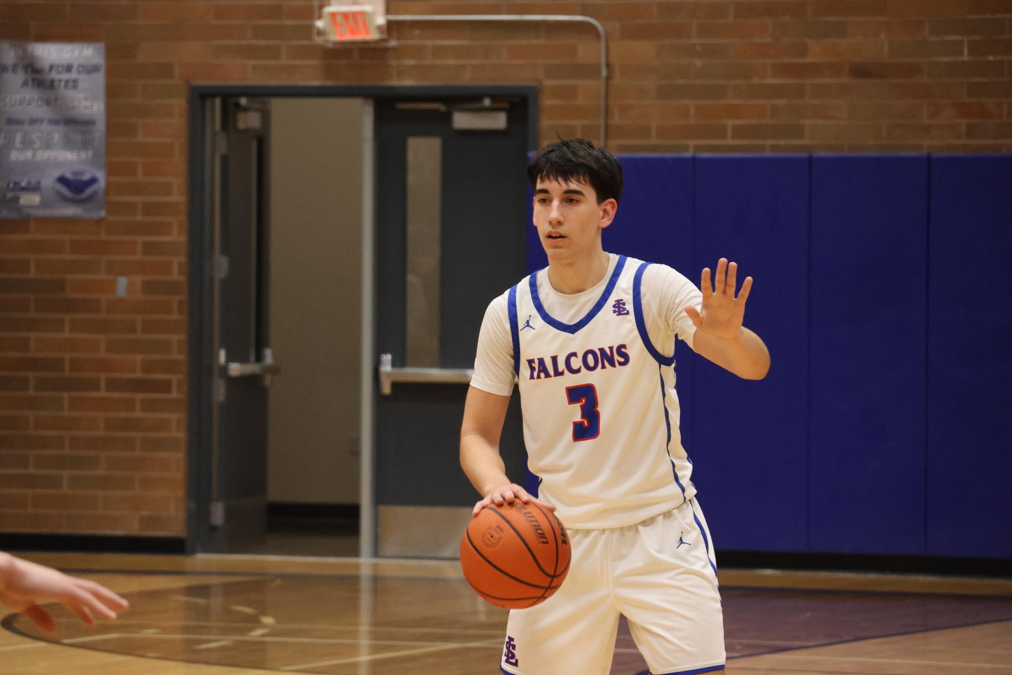 Photo Story: Boys Basketball Defends the Nest Against Rex Putnam